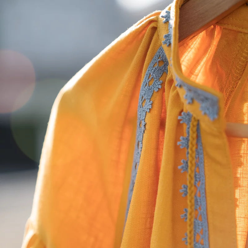 Kaftan dress in yellow.