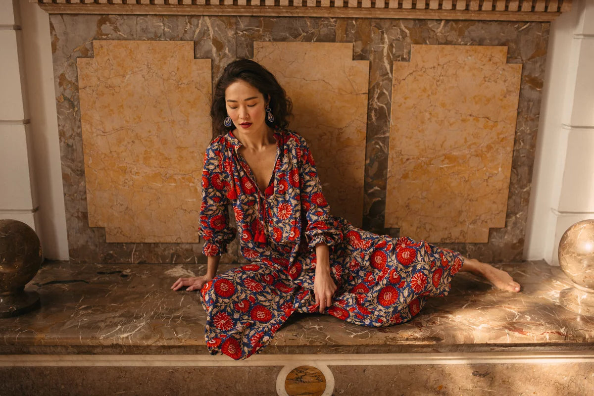 Asian woman wearing hand block printed long kaftan dress. 
